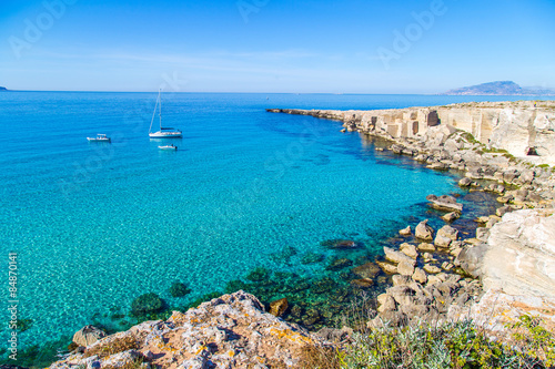 Lagoon with vessels on Favignana island in Sicily, Italy photo