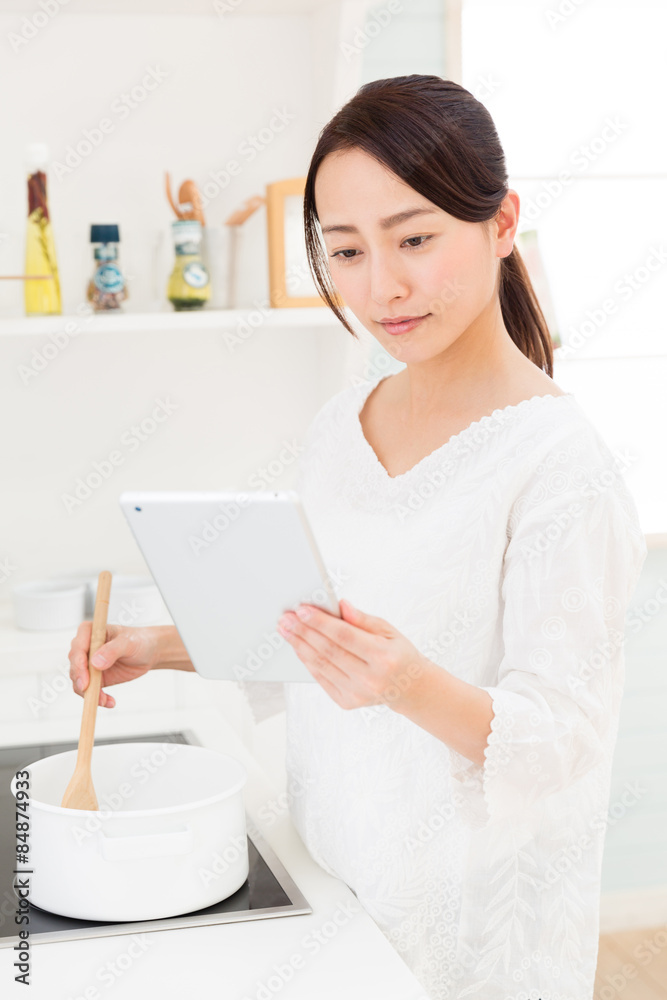 young asian woman in the kitchen