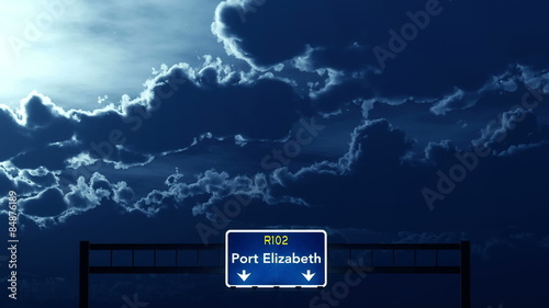 Passing under Port Elizabeth South Africa Highway Road Sign at Night
  