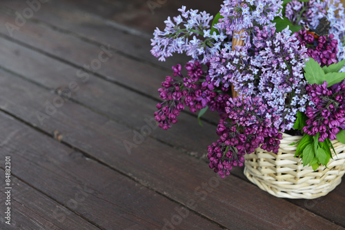 basket with  branch of lilac