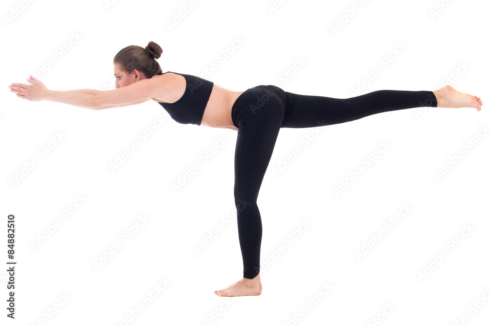 balance concept - young woman standing in yoga pose isolated on