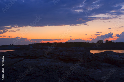 Sunset on a rocky shore.