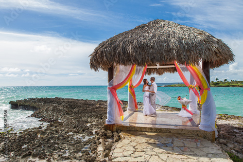 Young loving couple wedding in gazebo