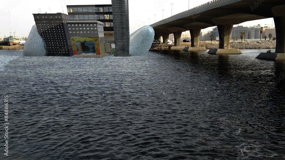 Small theater between buildings in water front from distance