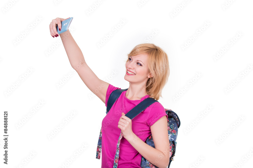 Young smiling woman making selfie with phone. Isolated