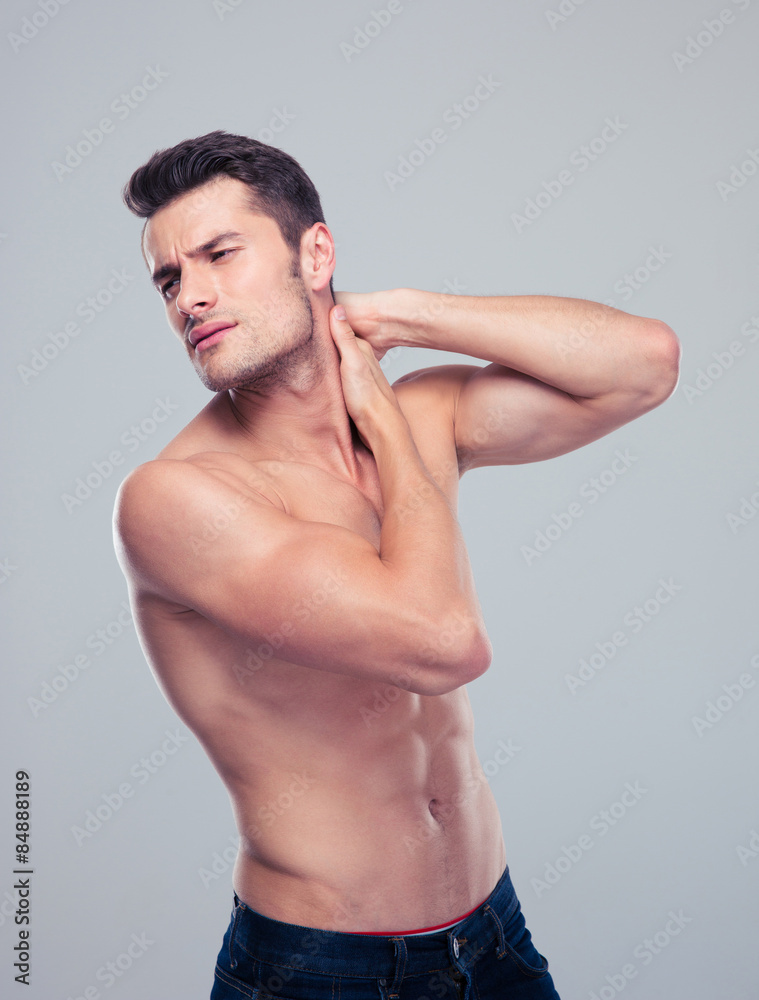 Portrait of a handsome man with neck pain Portrait of a handsome man with neck pain