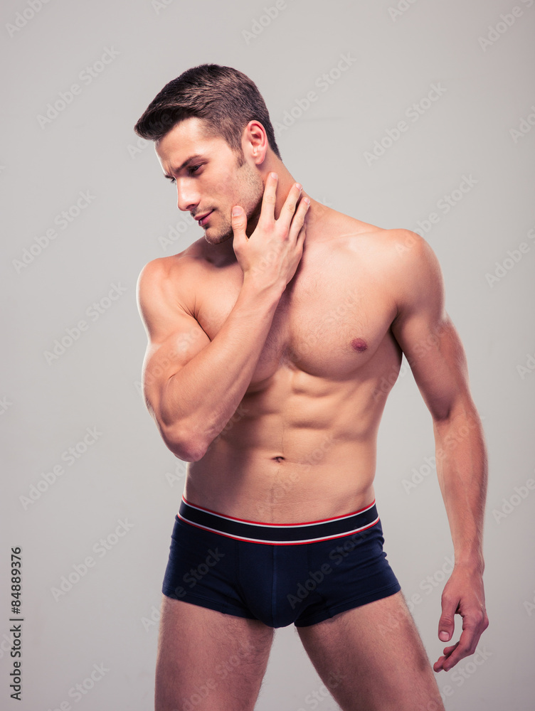 Handsome confident man with muscular body