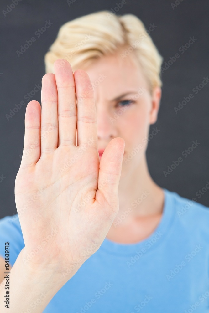 Stern woman gesturing with her hand Stern woman gesturing with her hand