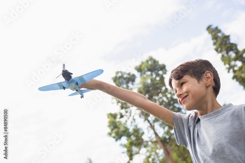 Boy playing with a toy plane at park © WavebreakmediaMicro