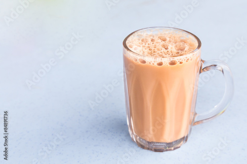 Milk tea or popularly known as teh tarik in Malaysia. photo