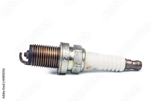 Close up of used spark plugs with focus on electrode with deposits