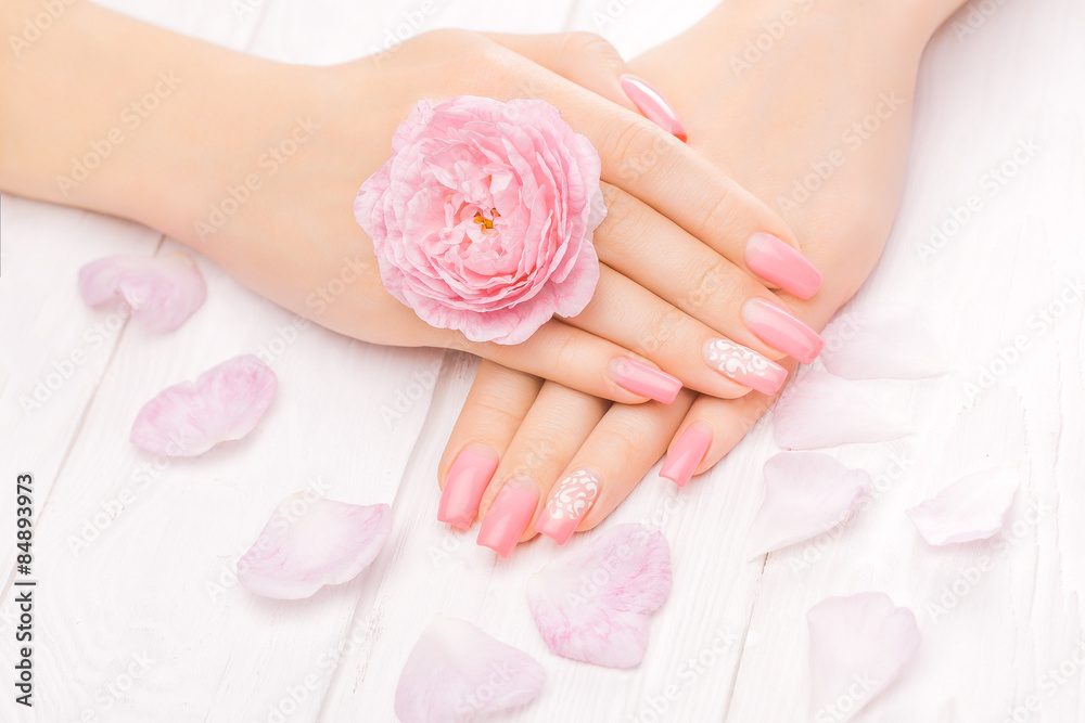 french manicure with rose flowers. spa