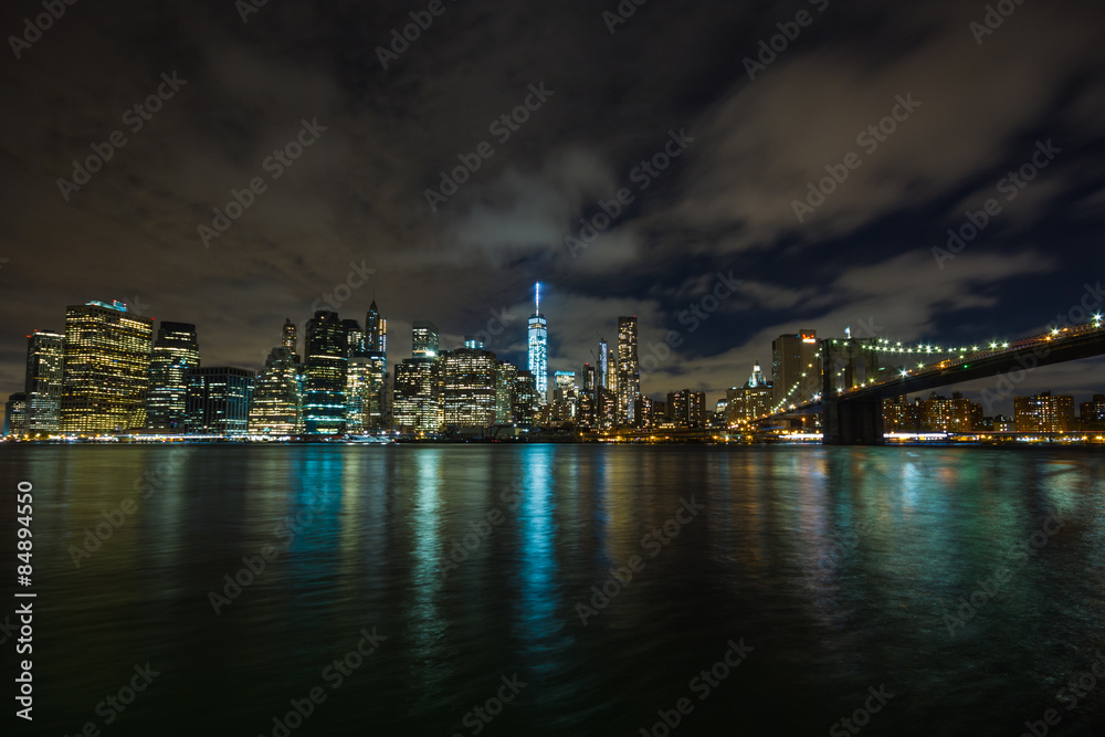New York by night: Lower Manhattan and the Brooklyn Bridge as seen from Brooklyn side, in the center of the picture the One World Trade Center (Freedom Tower)