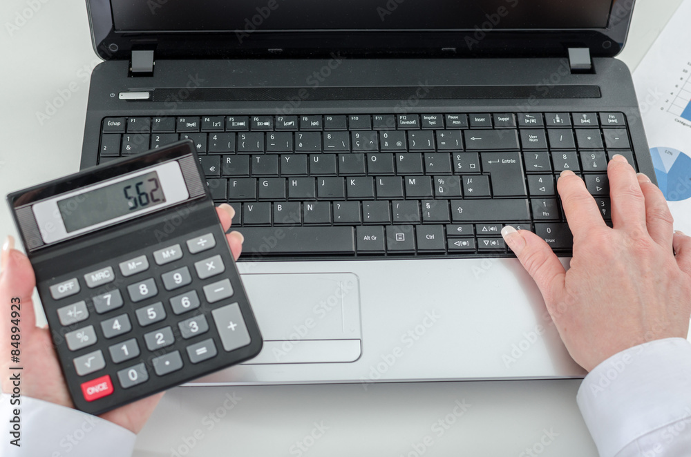 Accountant woman working on financial results Accountant woman working on financial results