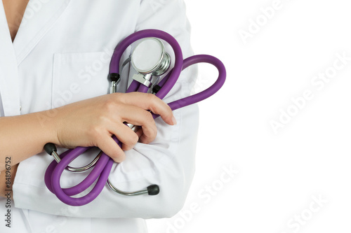 Female doctor's hands holding stethoscope