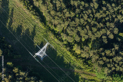 Aerial view of electrical wires large scale power energy tower