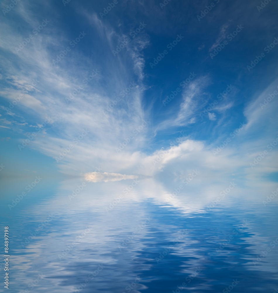 Sky with clouds reflected in water surface. Sky with clouds reflected in water surface.