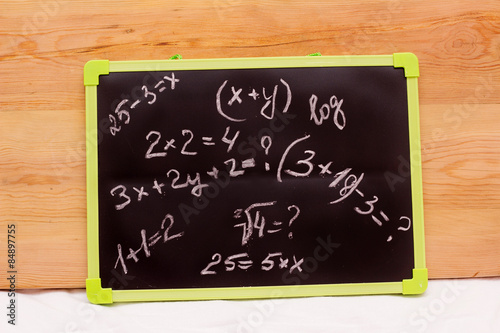 school example, written on a blackboard background photo