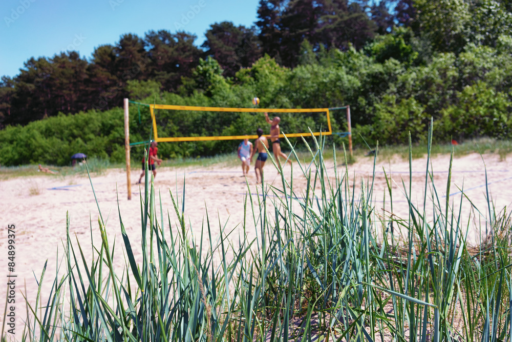 Fototapeta premium Play volleyball on the beach dunes summer