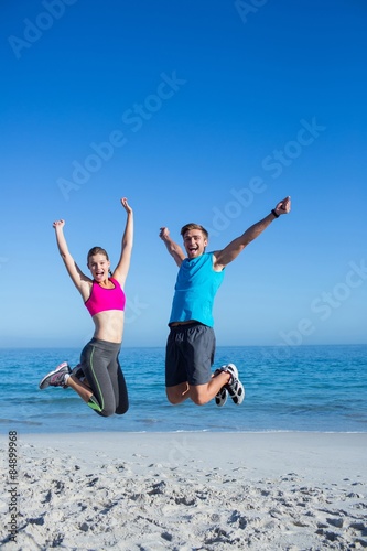Happy couple jumping together