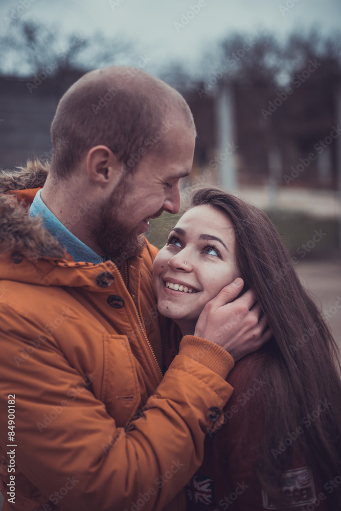 Happy Young Couple in Winter Park having fun.Family Outdoors. love Happy Young Couple in Winter Park having fun.Family Outdoors. love