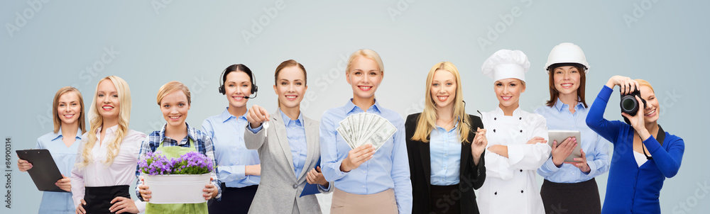 woman holding money over professional workers woman holding money over professional workers