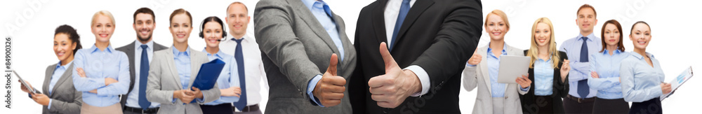 businessman and businesswoman showing thumbs up