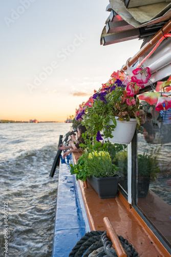 Motor launch cruising in the harbor of Hamburg. This launch is a special party boat where artists have performance, music, stand-ups and all kinds of arts © ksl