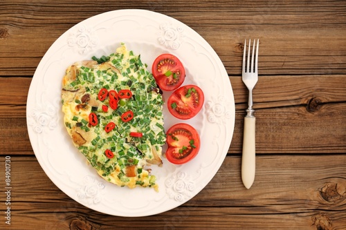 Porcini mushrooms omelette with tomatoes and scallion with white