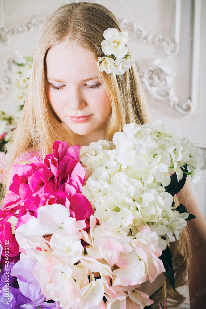 Portrait of attractive girl with a bouquet of flowers