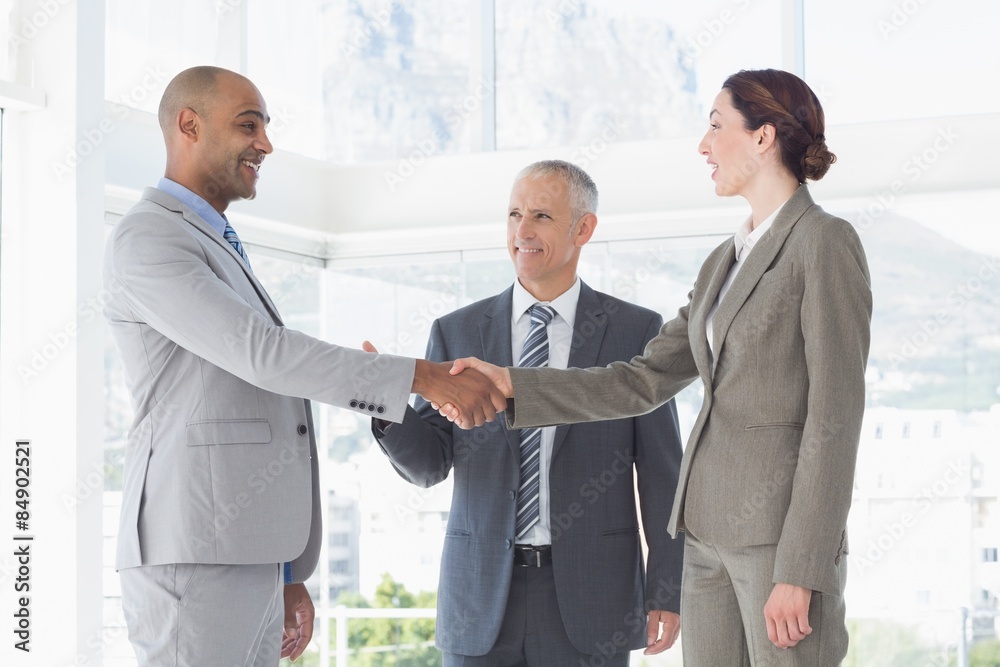 Business colleagues greeting each other Business colleagues greeting each other