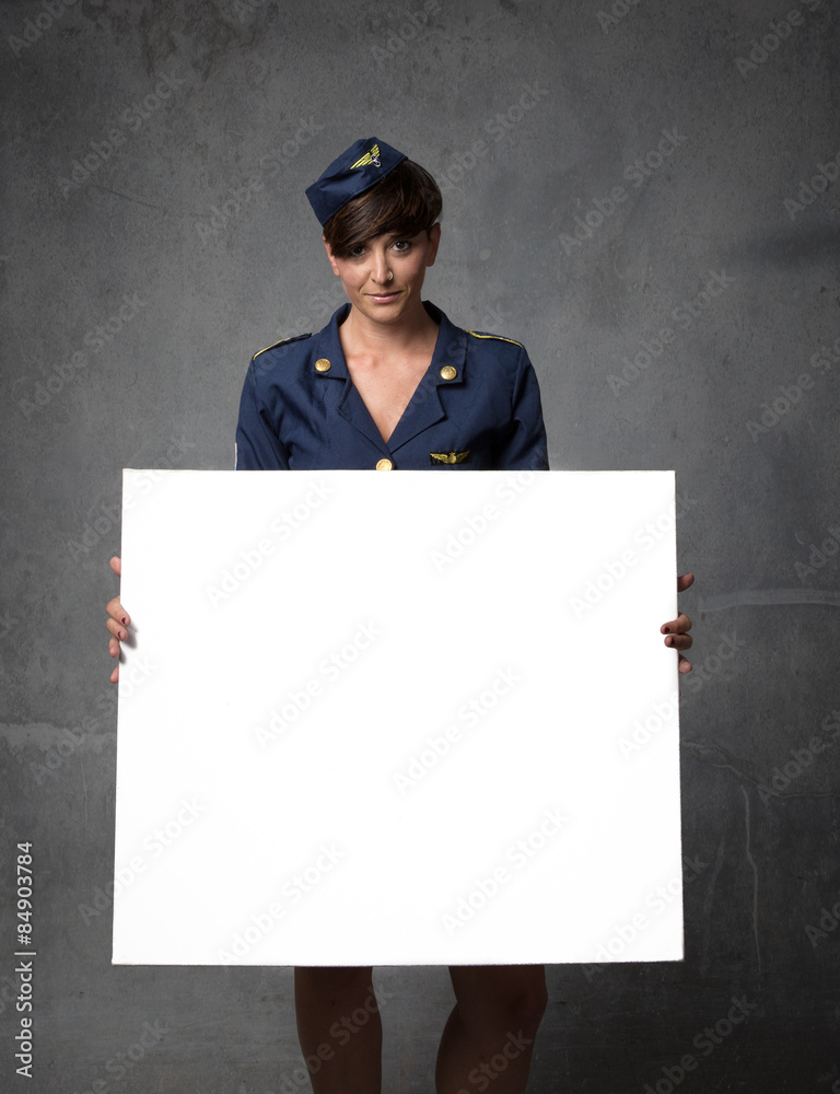 Air hostess with white empty board on hand