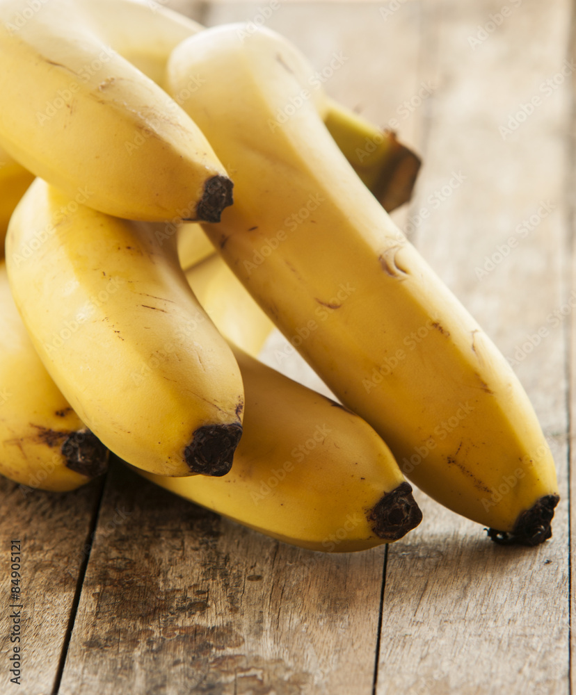Bananas isolated on wooden background Bananas isolated on wooden background