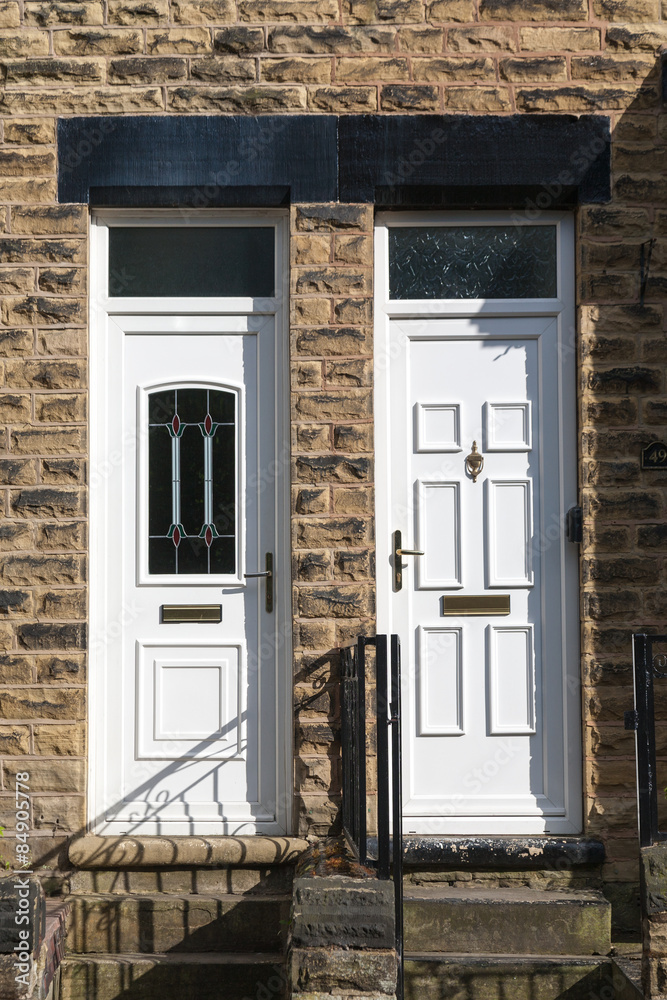 Naklejka premium White Front Door in a brick building,uk