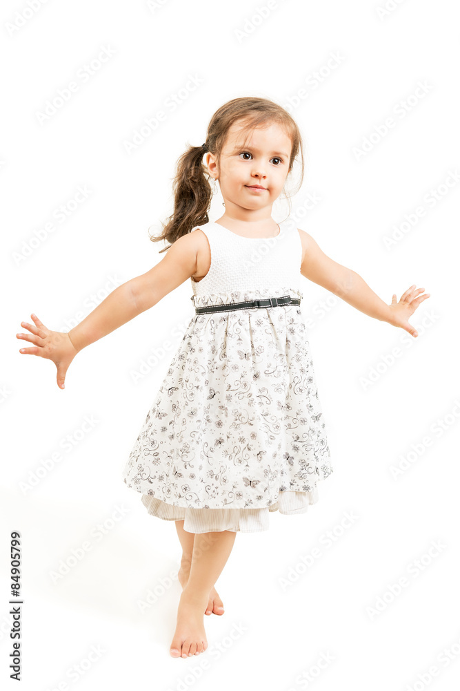 Cute little girl standing barefoot isolated Cute little girl standing barefoot isolated
