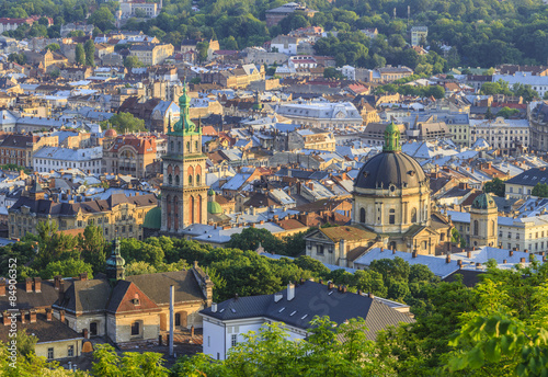 View of the city of Lviv from the High Castle Park at sunset photo
