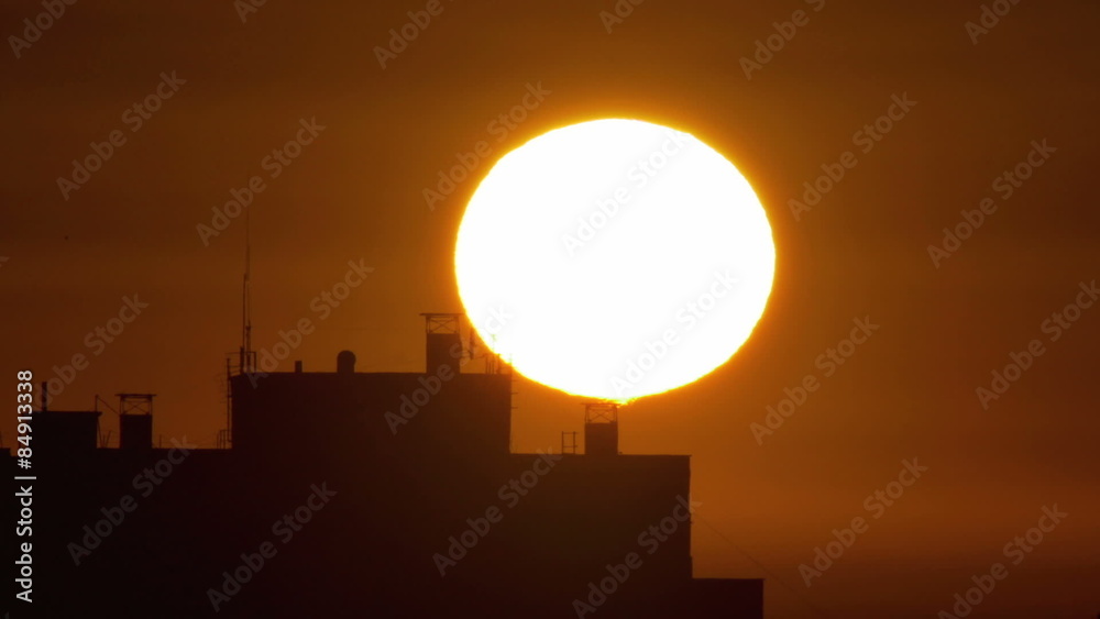 4 in 1 video! The sunrise above city buildings roof - extreme close up telescope view. Shot with Red Cinema Camera