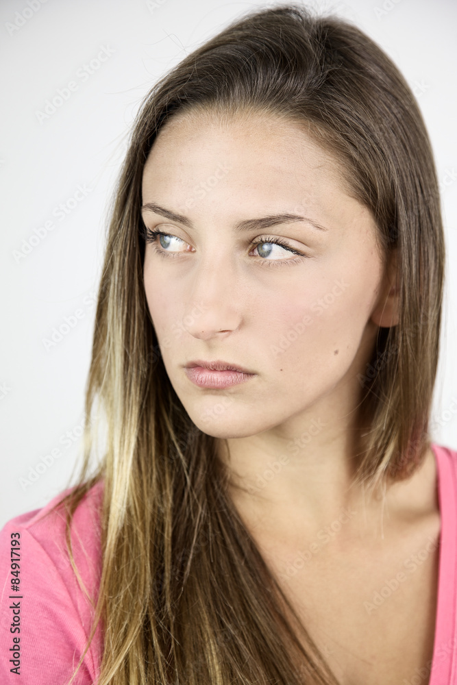 Closeup of serious female teenager thoughtful