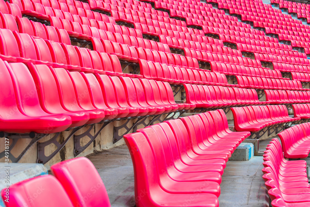Obraz premium stadium, red seats on stadium steps bleacher 
