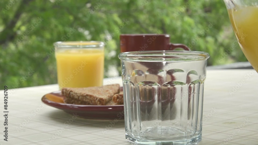 Serving toast and pouring orange juice
Serving toast and pouring orange juice