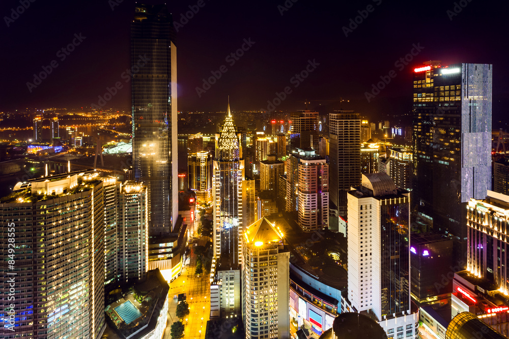 Obraz premium High angle view of illuminated skyline and modern buildings