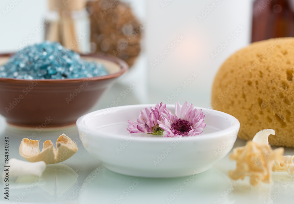 Spa concept with Floating Flowers Bath Salt and Bath sponge Spa concept with Floating Flowers Bath Salt and Bath sponge