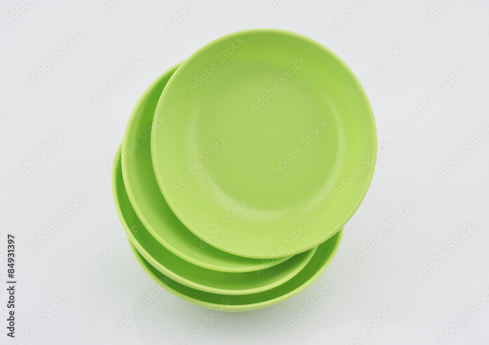 Green plastic bowls isolated on white Green plastic bowls isolated on white