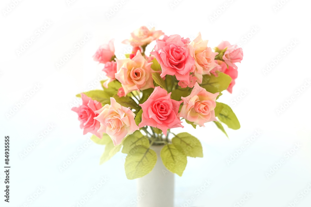 artificial pink roses bouquet in ceramic vase