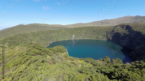 Aerial video footage of the calderira negra,Flores island on the volcano in azores, Fayal, Portugal  photo