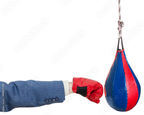 man in suit with boxing glove punches punching bag