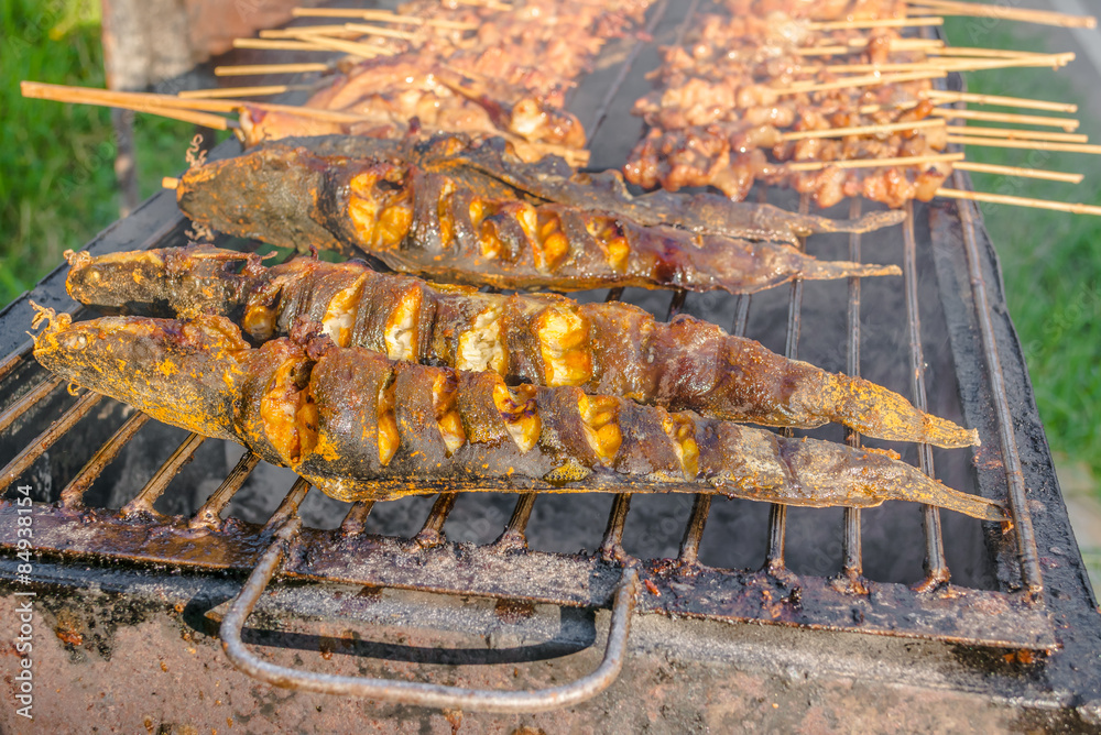 Walking catfish on grill, Thailand. Walking catfish on grill, Thailand.