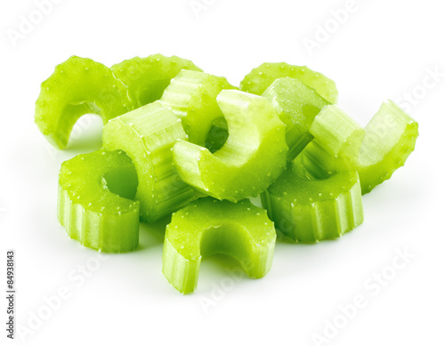 Green fresh celery pieces isolated on white