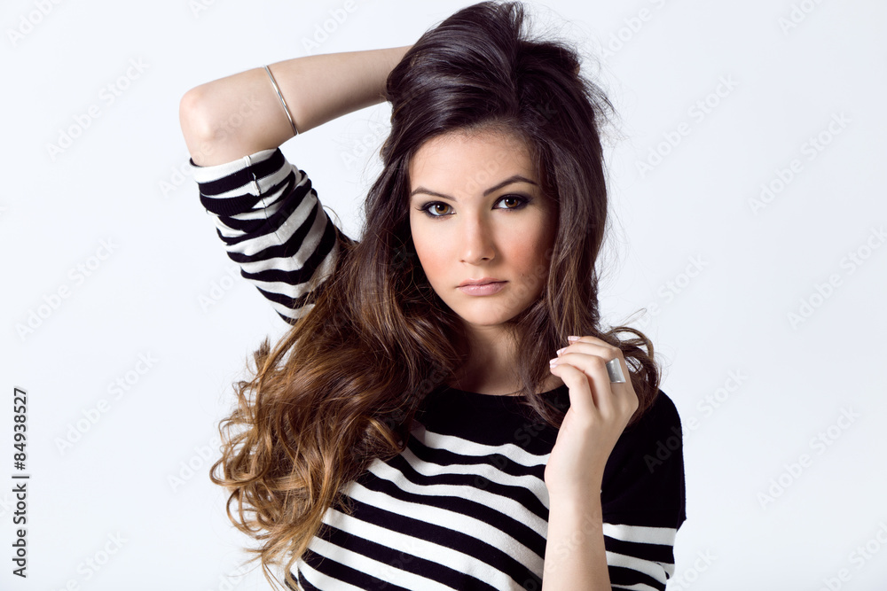 Fashion portrait of pretty young woman posing in the studio photo. Fashion portrait of pretty young woman posing in the studio photo.