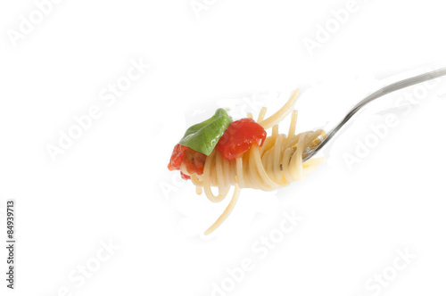 Spaghetti with fresh tomato rolled on fork. Traditional Italian Food